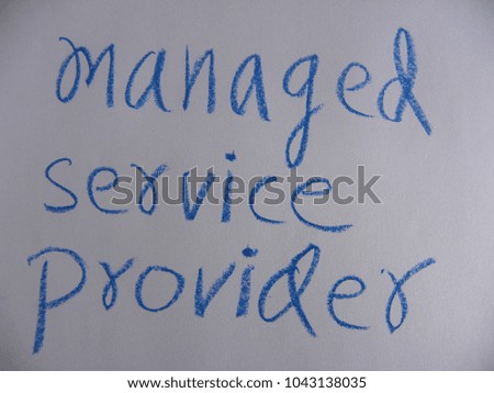 Text managed service provider hand written by blue oil pastel on white color paper