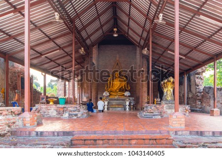 Aligned Sitting Buddha Statues and Buddha Status at Wat Yai Chaimongkol, Ayutthaya, Thailand