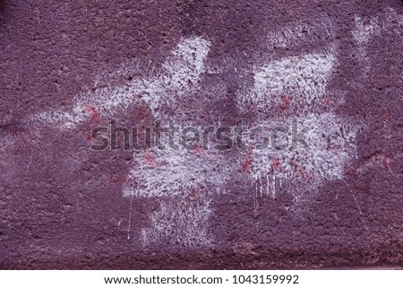Abstract paint spots on the walls of city houses. Beautiful street art graffiti. Abstract creative drawings of fashionable colors on the walls of the city. Abstract stylish drawing, graffiti fragment