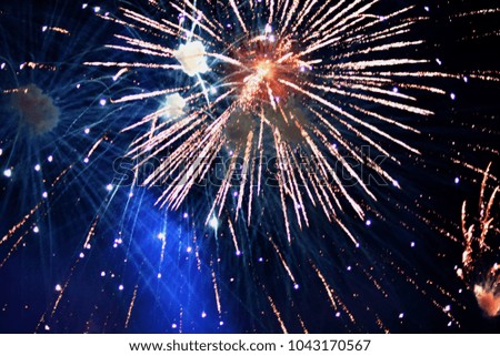Blurry of explosions of fireworks. For background and design