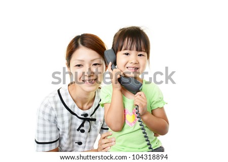 Daughter making a call for the first time and her mother