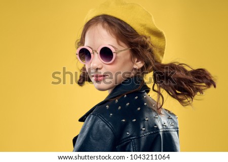  stylish girl on a yellow background                              