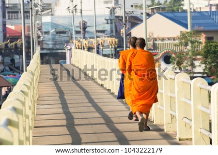 Monk walking in the morning on the bridge, Closeup Foots, Movement images