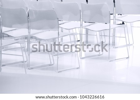 White chairs in the meeting room, elegant interior background