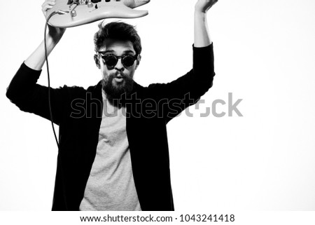  man with guitar, black and white photo                              