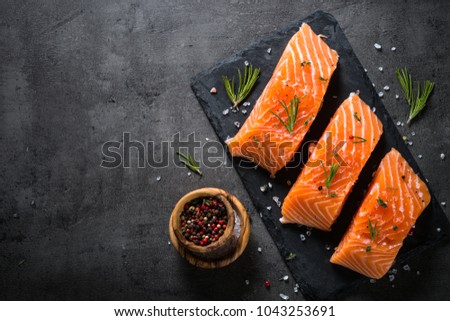 Fresh fish. Salmon fillet on black. Royalty-Free Stock Photo #1043253691