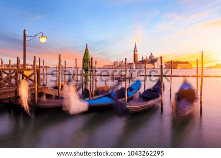 Sunset in Venice. Gondolas at Saint Mark's Square and church of San Giorgio Maggiore on background, Italy, Europe
