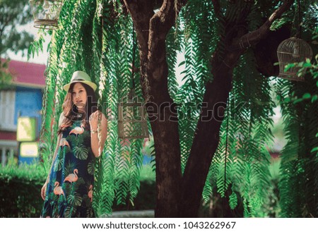 Summer holiday relaxing idyllic Concept. Outdoor fashion photo portrait lady of a beautiful young tender girl and hipster asian woman model posing and smiling  during Summer travel .