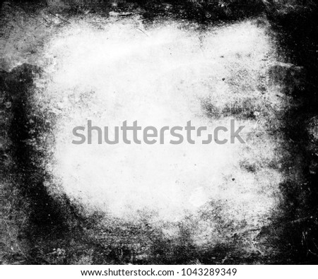 Grunge scary scratched texture background with faded central area for your text or picture