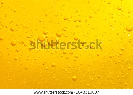 Focus boiling yellow oil spread widely bubble texture full frame and macro many various droplets Royalty-Free Stock Photo #1043310007