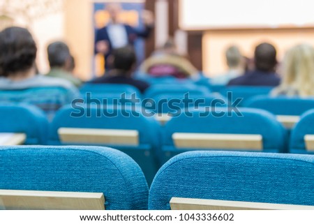 Business Meetings Concepts. Mature Experienced Male Presenter Giving a Talk in Front of the Group Of Listeneres During a Conference.Horizontal Image