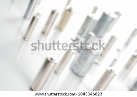 Ecology recycling concept, nature energy, many different types, used or new battery, rechargeable accumulator, alkaline batteries on white background. defocused blurred picture