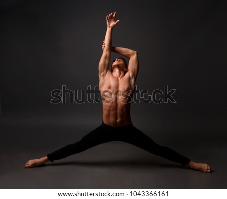 A professional dancer in black trousers, dances