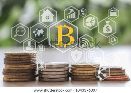 Bitcoins on the touch screen with a  blur financial background .The latest technology work with Finance in the networks.The concept of distribution of bitcoins