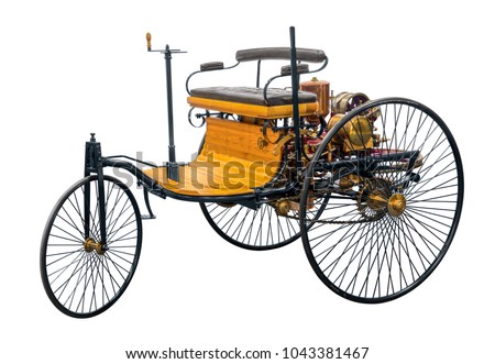 replica of a old historic vehicle named patent motorcar isolated in white back Royalty-Free Stock Photo #1043381467