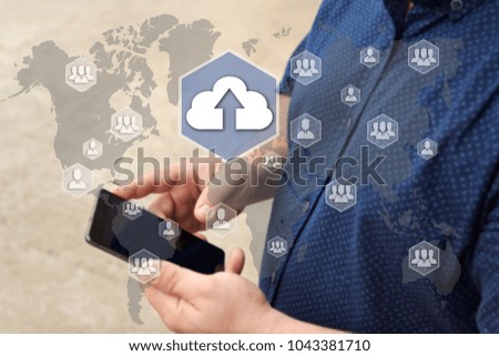 Upload cloud storage on the touch screen with a blur background of the businessman with the phone.The concept of Upload cloud connection 
