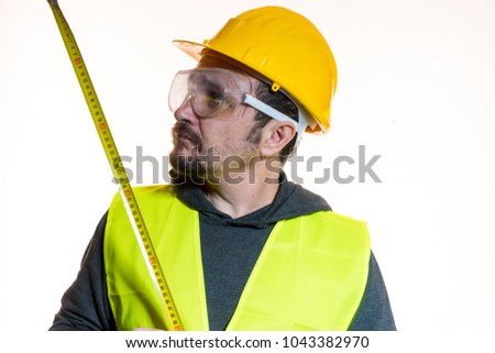 a man who wants to do a work without knowledge, work without experience. Do it yourself, man dressed in yellow builder helmet with protective glasses ready to start the construction work