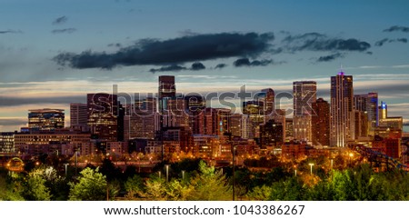 Skyline close up of Denver Colorado with the lights of morning
