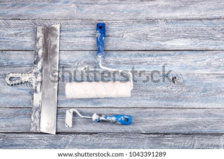 professional repairing implements for decorating and building renovation set, wall in the background