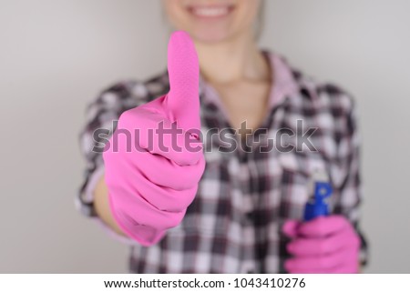 Choose choice symbol person people concept. Close up photo of lady cleaner giving making demonstrating thumb-upholding sprayer in hand isolated on gray background copy-space