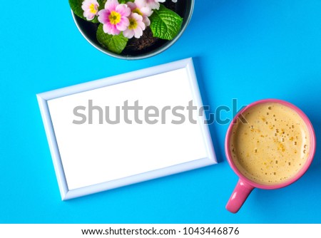 Photo frame flowers coffee cappuccino cup tender romantic blue background Your photo text