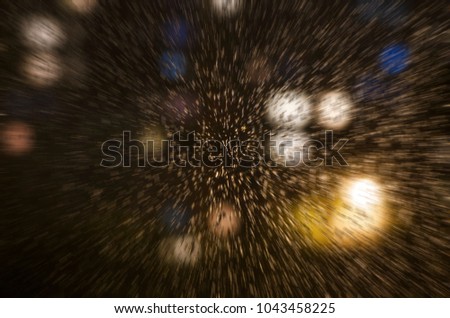 drops of rain on the window on the background of the night bokeh. Emotional melancholic abstract background with defocused lights. Focus on few drops due to the shallow depth of field. Blured