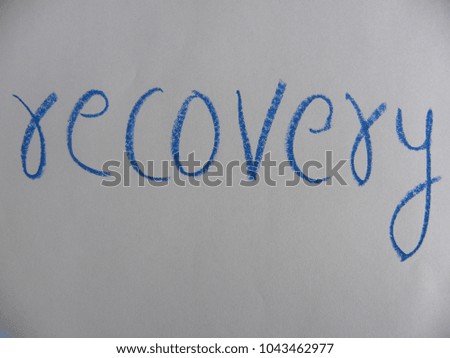 Text recovery written by blue oil pastel on white color paper