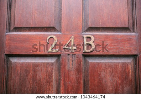 Address number in a wooden door