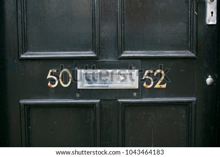 Address number in a wooden door