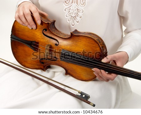 antique red violin on white
