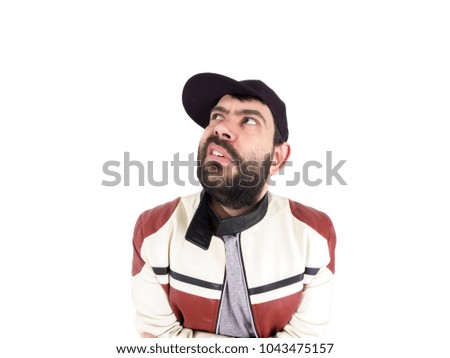 Guy with cap and jacket making funny expressions
