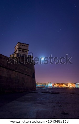 Fort Perch Rock in the early hours with the Moon setting 