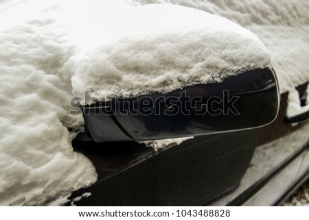 Snow build up on a car background.