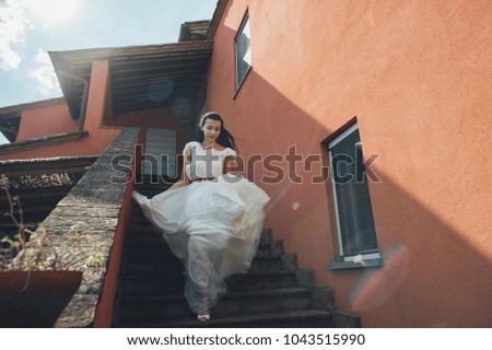Smiling bride in the ancient city. Rome Italy. Wedding dress. A beautiful smiling bride is happy