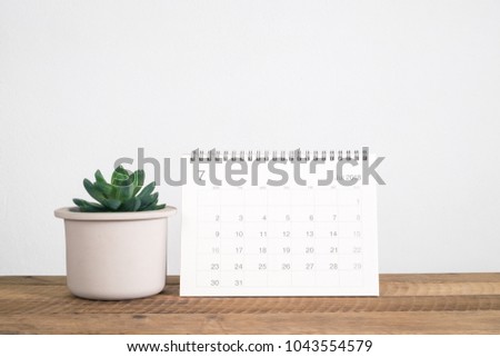 Calendar July 2018 and cactus on table Royalty-Free Stock Photo #1043554579