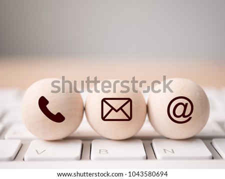 Wood sphere symbol telephone, mail, address and mobile phone. Website page contact us or e-mail marketing concept Royalty-Free Stock Photo #1043580694