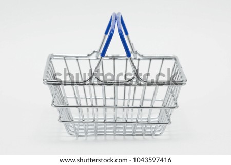 Steel shopping basket on white background
