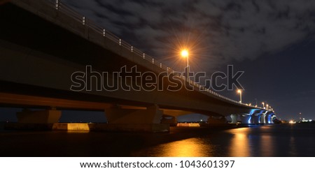 Night shot of Hathaway Bridge, Panama City, Fl. Royalty-Free Stock Photo #1043601397