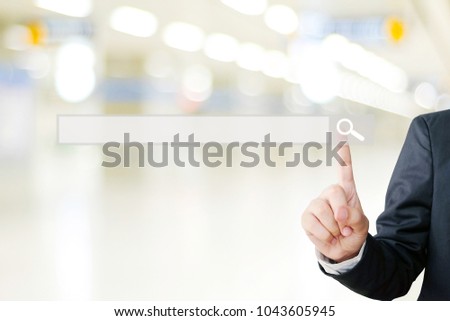 Businessman hand touching blank search bar over blur background, business and technology concept, search engine optimization, web banner
