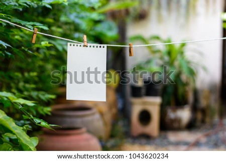 Wood, paper clip for hanging notes.