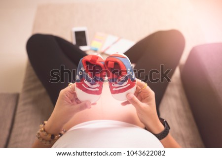 Motherhood pregnant shopping to prepare for new born baby