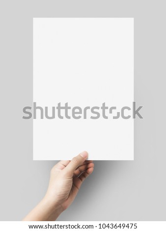 Hand holding gray color paper blank