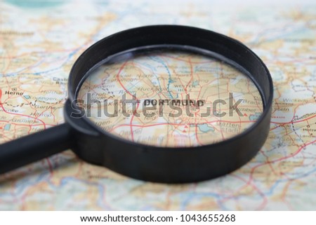 Close up of Dortmund City under a magnifying glass on a map