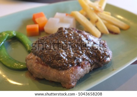 Picture for THAI steak catalogs menu , Delicious beef Steak Black Pepper Sauce with French fries and vegetable