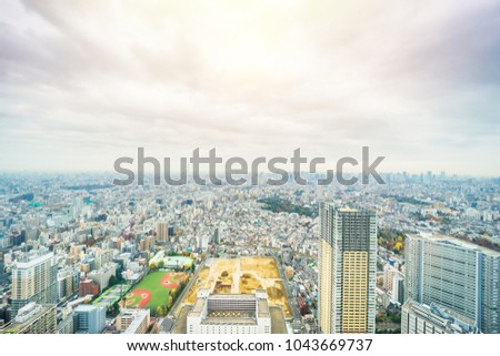 Asia business concept for real estate and corporate construction - panoramic modern city skyline aerial view of Ikebukuro with baseball field, construction site in tokyo, Japan