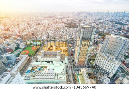 Asia business concept for real estate and corporate construction - panoramic modern city skyline aerial view of Ikebukuro with baseball field, construction site in tokyo, Japan