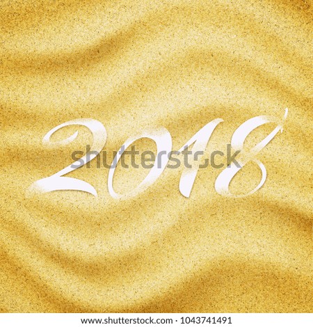 2018 in sand background. Close-up of sand grains