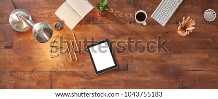 digital tablet on the table and technological term detail isolated for advertisement screen with lamp concept