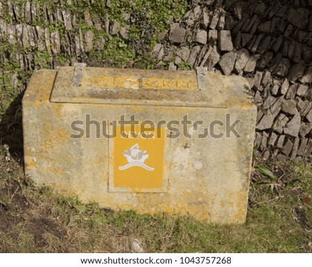 Plastic Box of Grit on a Quiet Country Lane within Exmoor National Park in the Rural County of Devon, England, UK