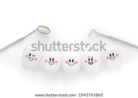 Teeth smile emotion with dental mirror and dental plaque cleaning tool isolated on white background, With clipping path Royalty-Free Stock Photo #1043765860